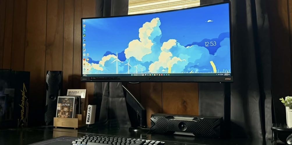 HUANUO Single Monitor Arm for 13-49 inch Screens, Ultrawide Computer Monitor Mount Holds 26.48 lbs, Upgraded Adjustable Stand with USB, C-Clamp & Grommet Base, VESA 75x75 or 100x100mm customer photo 1