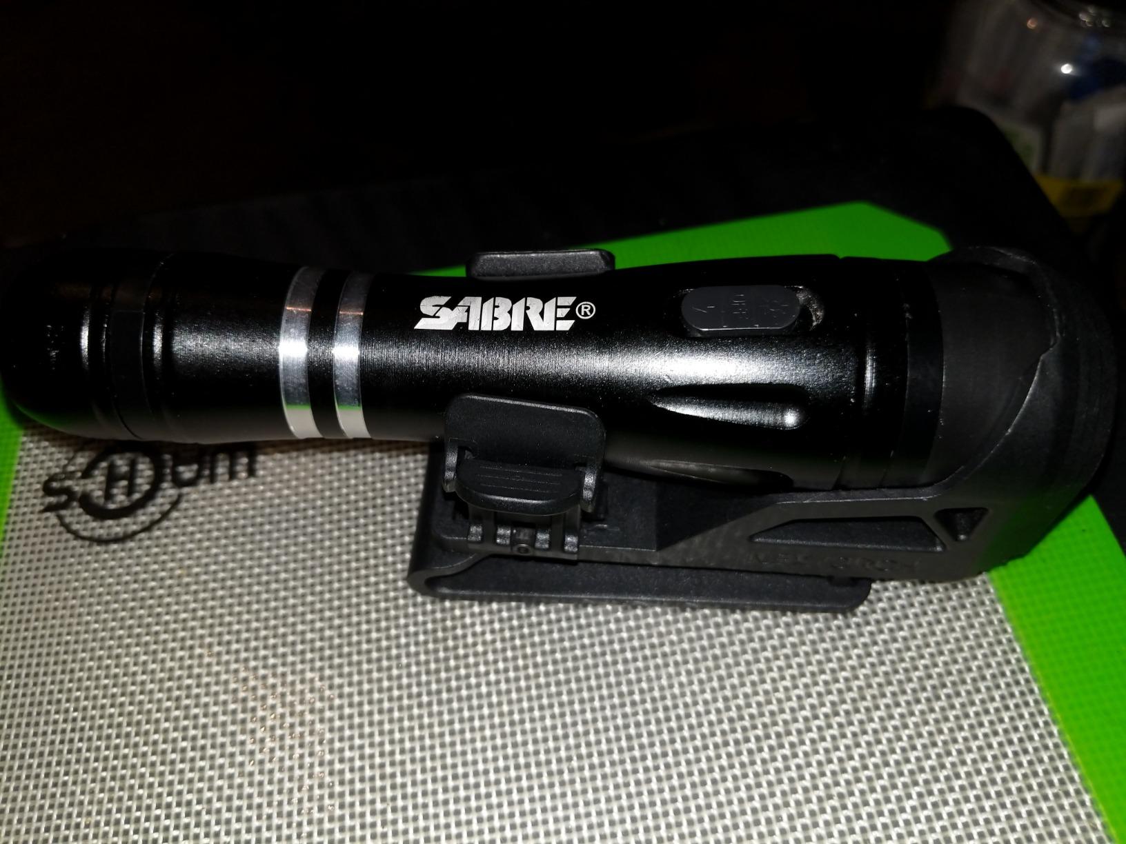 SABRE 2-in-1 Tactical Stun Gun with LED Flashlight, Self Defense Stun Gun with 2.517 µC Charge Produces Intolerable Pain, 130 Lumen LED Light, Safety Switch, Belt Holster, Rechargeable Battery customer photo 1