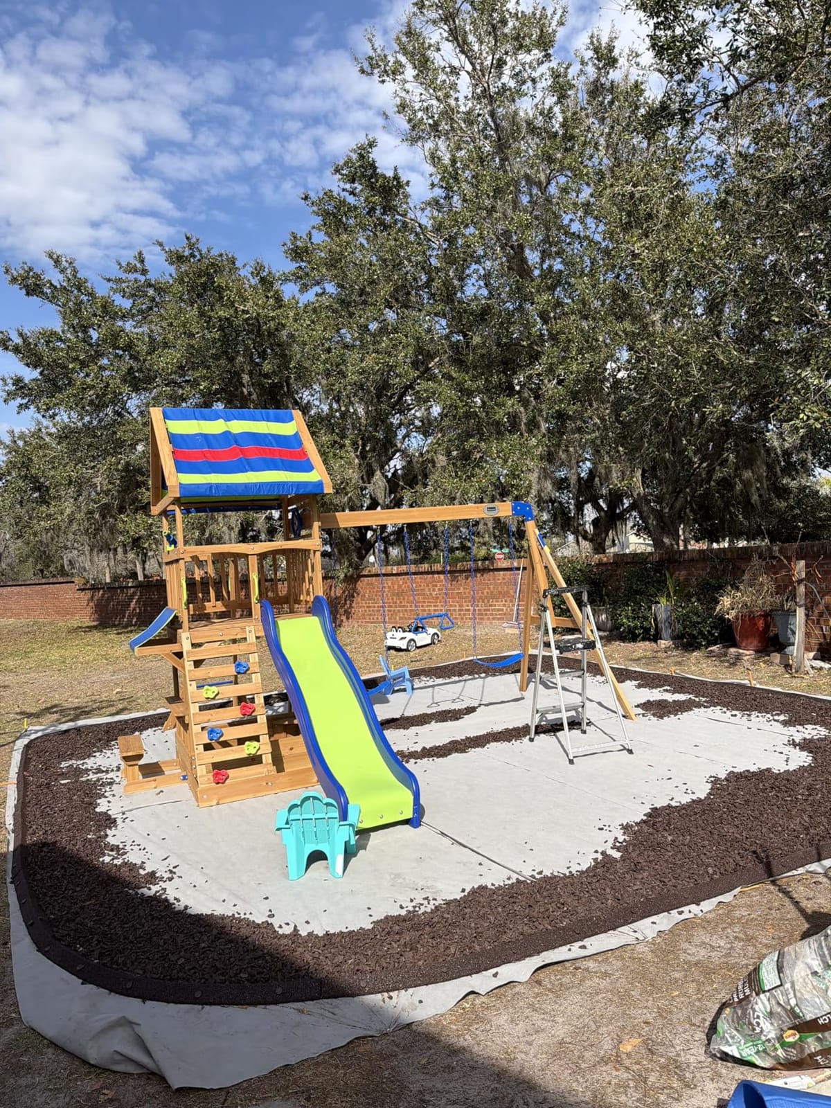 Backyard Discovery Beach Front Cedar Wood Swing Set with Wave Slide, Play Deck, Monkey Bars, Rock Wall Ladder, Shaded Picnic Area, Snack Bar, Belt Swings, Trapeze, Sandbox Area, Outdoor Playset customer photo 2