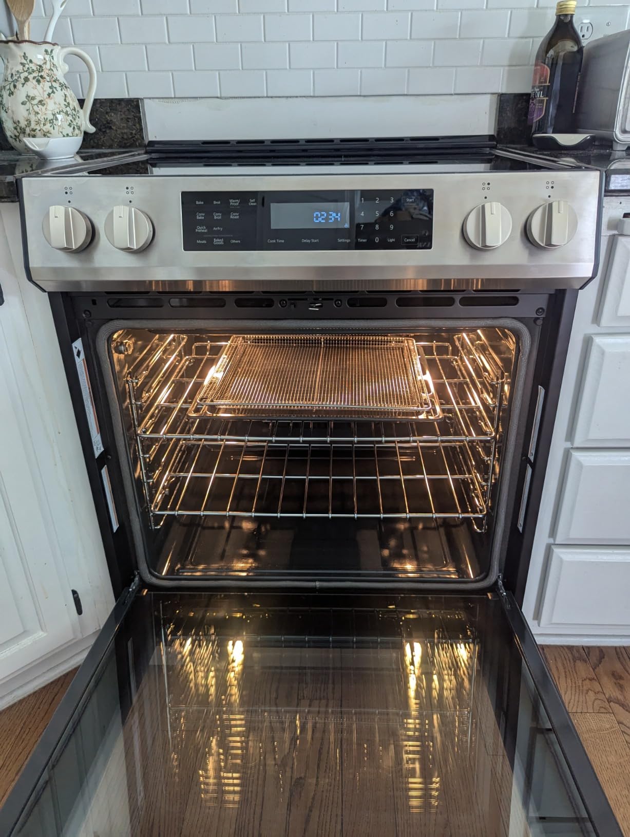 Kenmore 5.6 cu. ft. Electric Induction Range Oven - Stainless Steel | Front Controls, 4 Induction Elements, Turbo Boil, True Convection, Air Fry, Temperature Probe, Self Clean, Storage Drawer customer photo 1