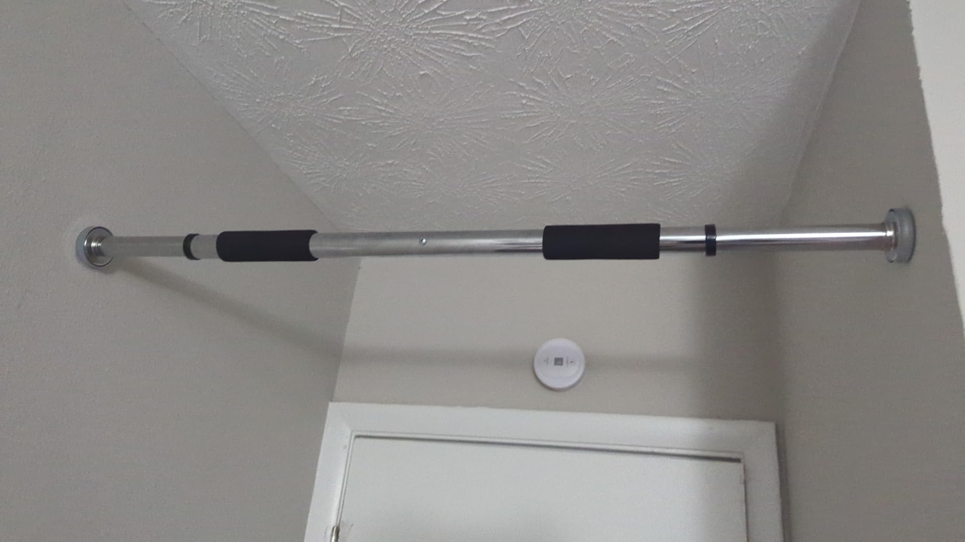 Sunny Health & Fitness Adjustable Doorway Chin Up/Pull Up Bar | Adjustable Doorway Fitment, Strong Steel Frame, Foam Padded Handlebars, Anti-Slip Pads, Ideal for Upper Body Workouts customer photo 1