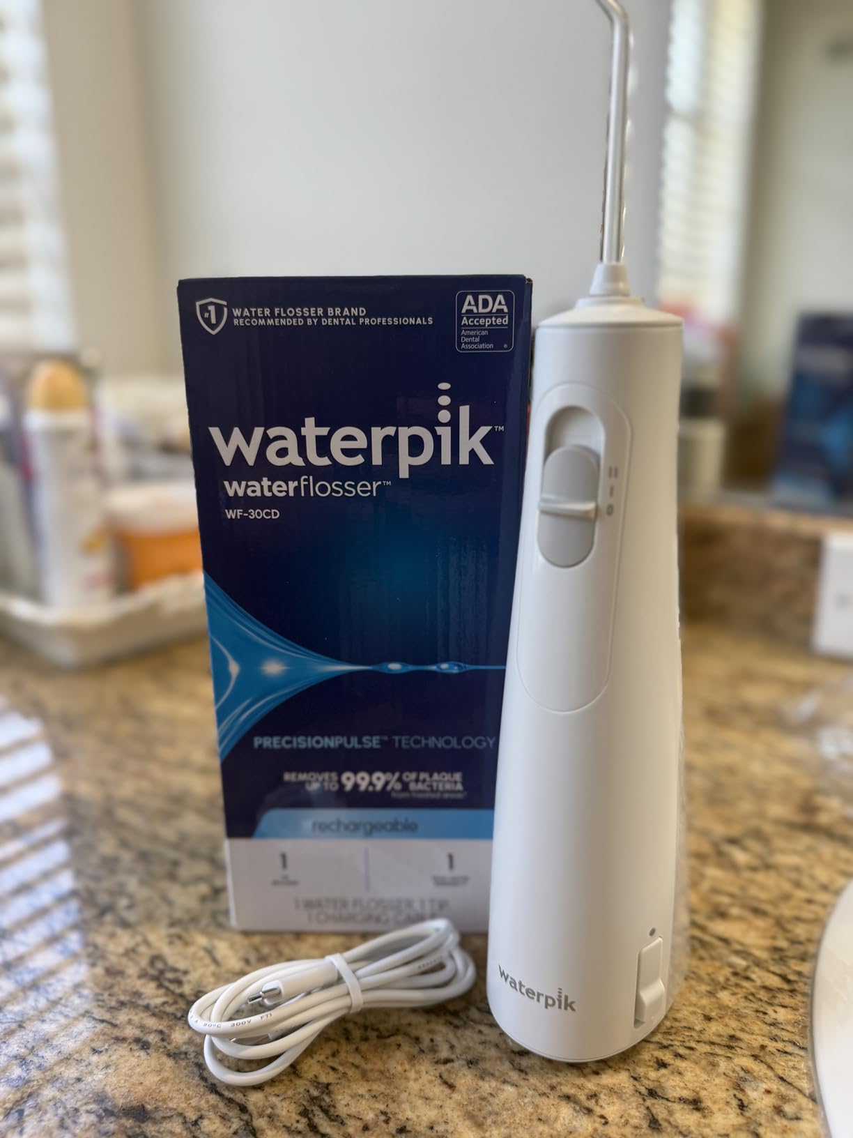 Waterpik Cordless 1100 Rechargeable Portable Water Flosser for Teeth Cleaning and Flossing, Travel, Braces Care, Healthier Gums, Waterproof for Shower, ADA Accepted, WF-30CD White, Packaging May Vary customer photo 1