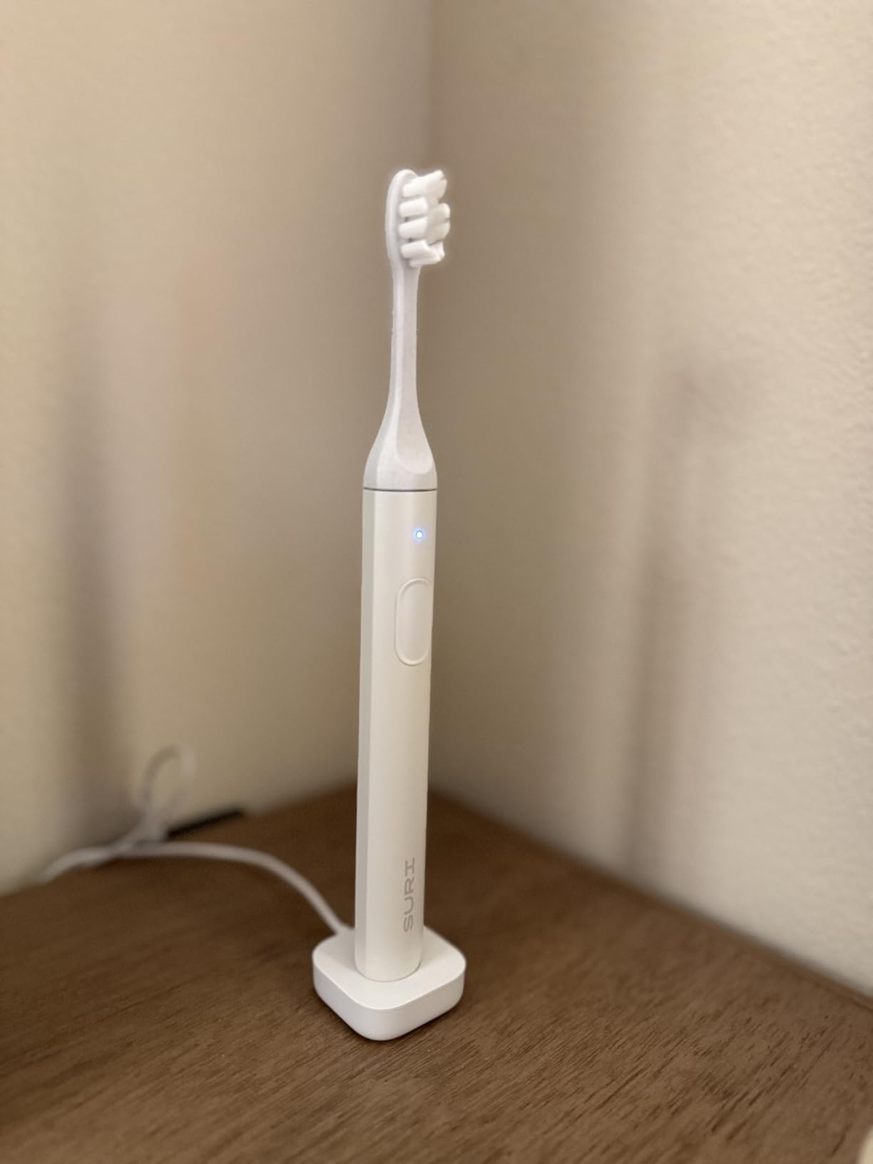 SURI Pro Sonic Electric Toothbrush | Over 4+ Weeks Battery | UV Cleaning Travel Case | Pressure Sensor | Aluminium Body | 2-Minute Timer | Plant-Based Head | Green customer photo 1