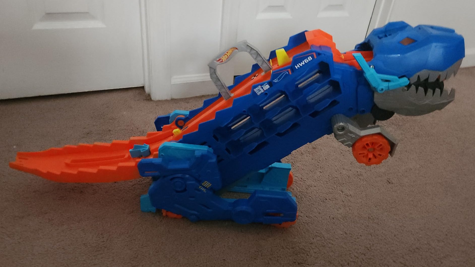 Hot Wheels City Toy Car Track Set, Ultimate T-Rex Transporter, Hauler Transforms into Stomping Dino with Race Track, from Netflix Series “Let’s Race” customer photo 2